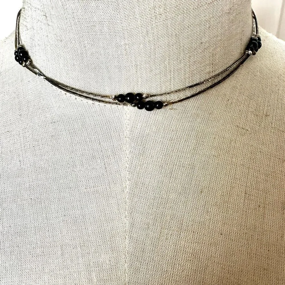 Black and silver tone long beaded necklace